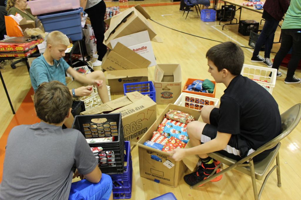 Above, you can see students working to pack and ship gifts.