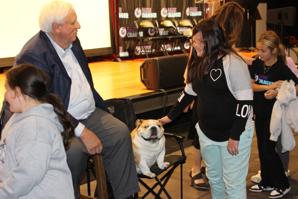 Babydog greets students.